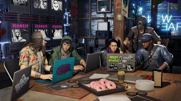 Szene aus dem Actionspiel "Watch Dogs 2" - eine Gruppe aus fünf Hackern sitzt mit ihren Laptops an einem Tisch